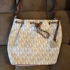 Michael Kors white logo draw string bucket handbag